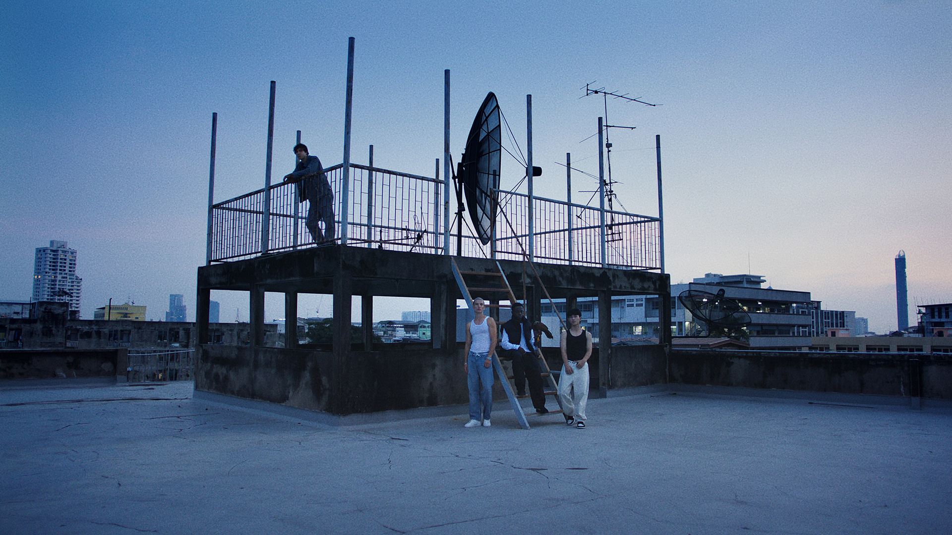 Rita-Ora-x-Tiago-PZK-x-Robin-Schulz-Ill-Be-There-satellite-by-Robert-Wunsch Guys hanging out at a satellite station during blue hour.