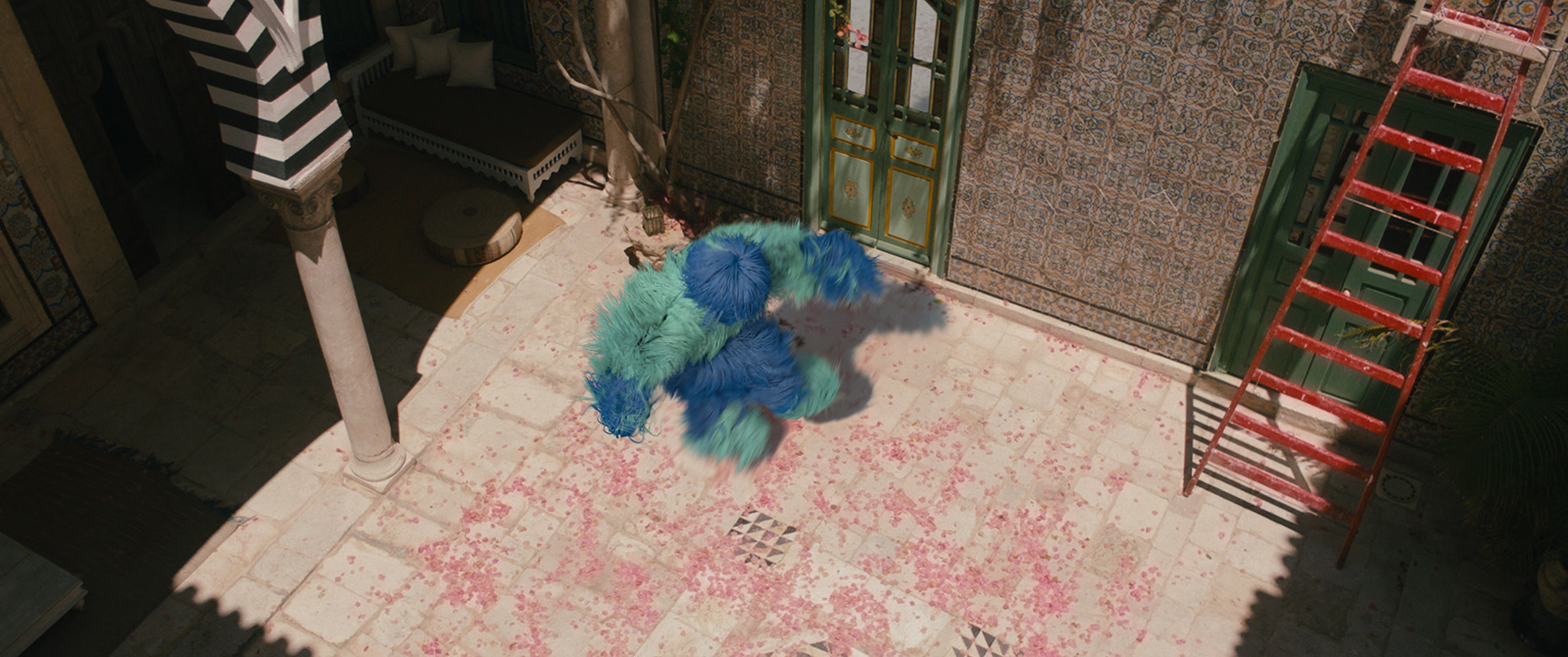 Robin-Schulz-Ft-Wes-Alane-dance-sunlight-by-Robert-Wunsch Blue fluffy figure dancing outside apartment in sunlight.