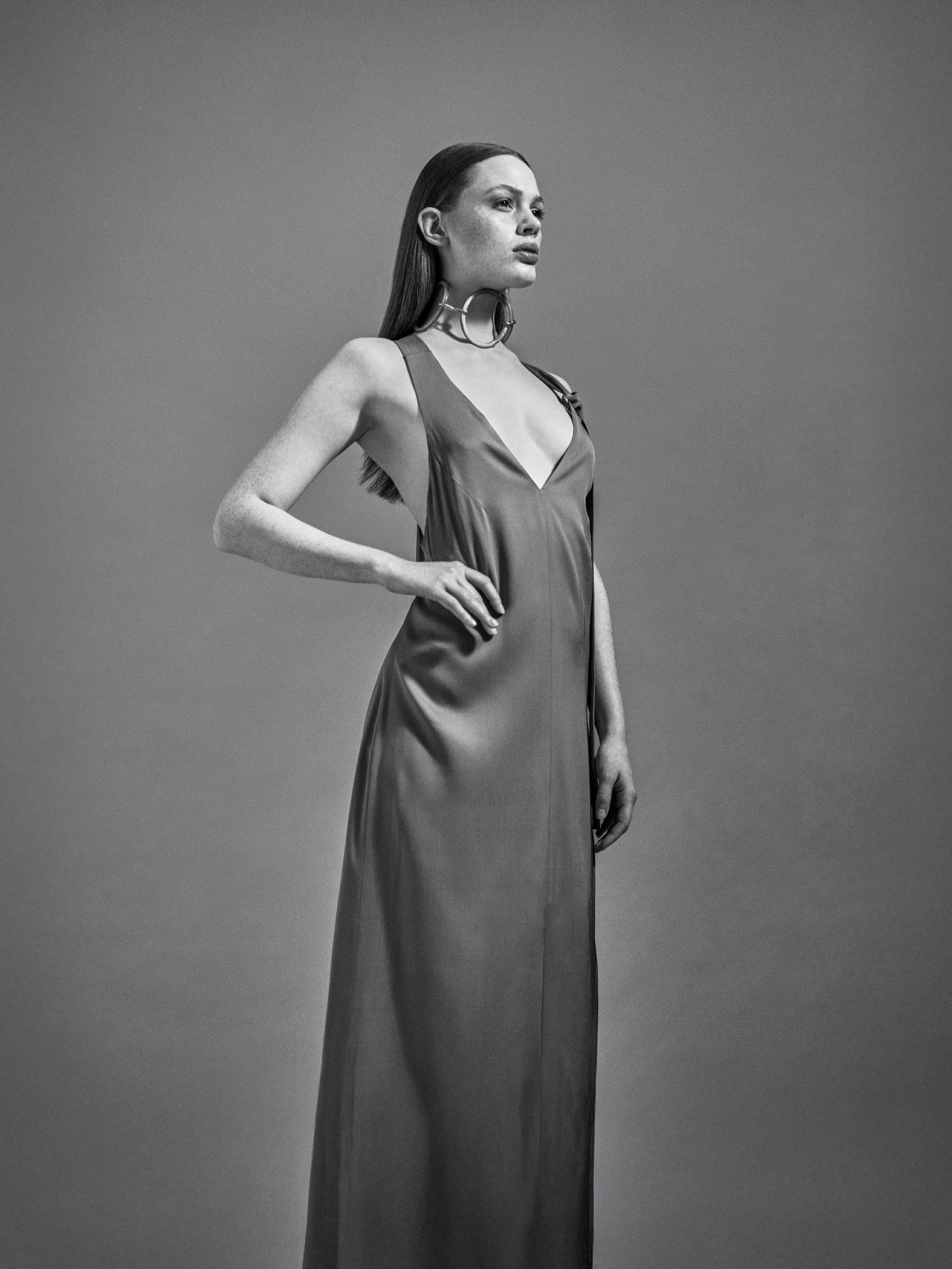 The-Row-campaign-stance-by-Robert-Wunsch Girl standing confidently in silky dress.